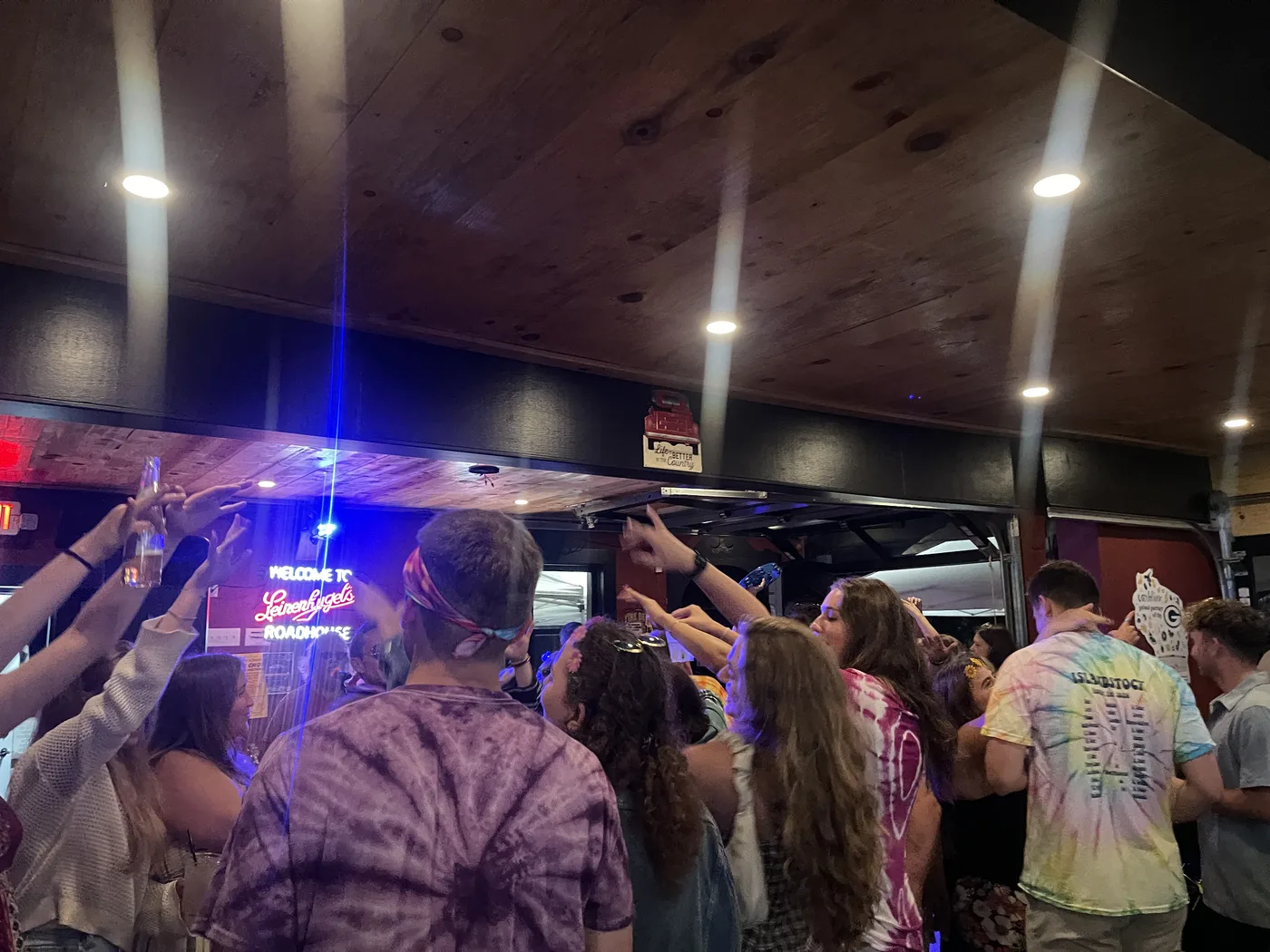 A lively crowd watching Mud Music & Mayhem