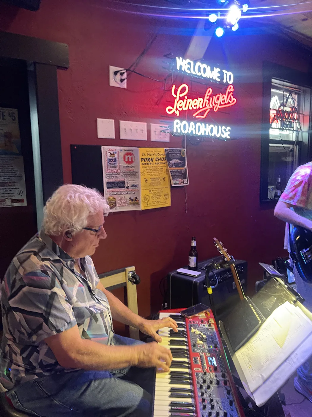 Keyboard player performing with the band